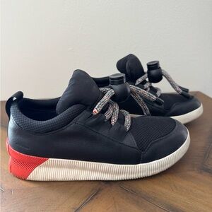 Sorel Black Sneakers with Red Heel Accent